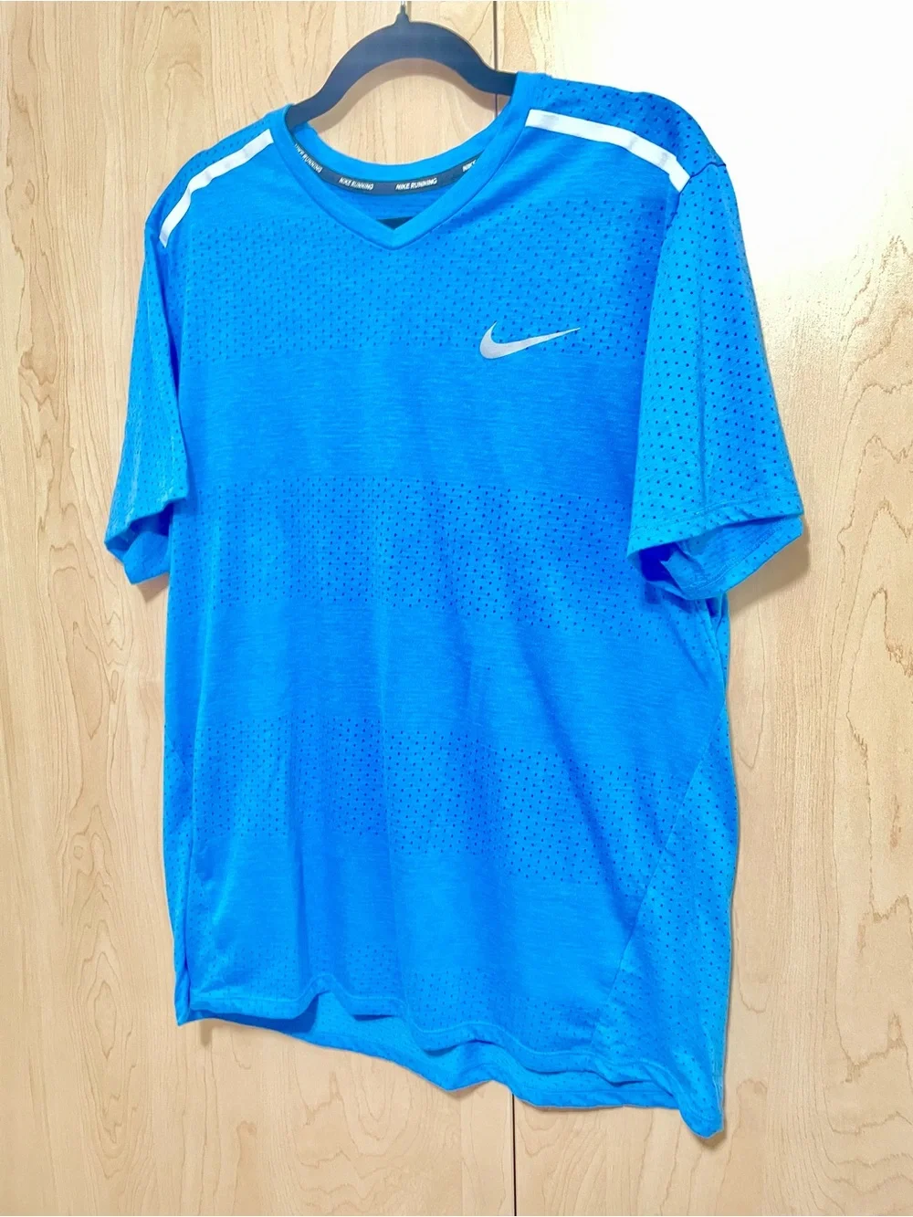 Nike Dri-Fit Women’s Blue Performance V-Neck Tee with White Reflective Accents - Picture 2 of 8